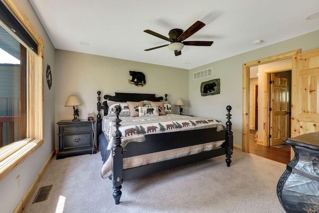 5997 Prospect St, Indian River, MI 49749 - carpeted bedroom with a ceiling fan and baseboards