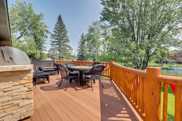 5997 Prospect St, Indian River, MI 49749 - wooden deck featuring outdoor dining area and area for grilling
