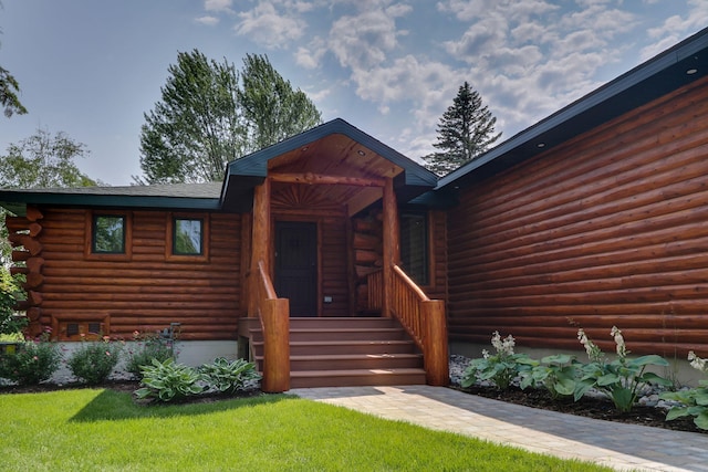 5997 Prospect St, Indian River, MI 49749 - view of front of home featuring log siding and a front lawn