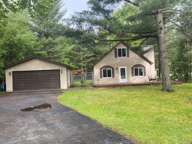 117 Swift Deer Trl, Prudenville, MI 48651 - view of front of home featuring a garage, a chimney, an outbuilding, a gate, and view of wooded area
