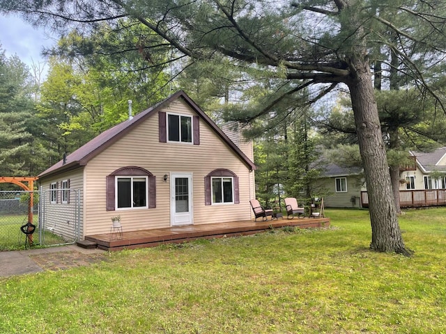 117 Swift Deer Trl, Prudenville, MI 48651 - back of property with a deck