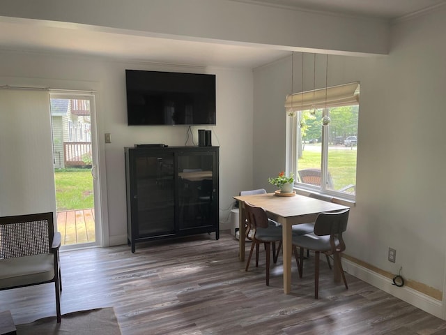 117 Swift Deer Trl, Prudenville, MI 48651 - dining area featuring wood finished floors, crown molding, and baseboards