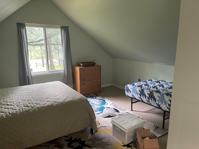 117 Swift Deer Trl, Prudenville, MI 48651 - bedroom featuring carpet, vaulted ceiling, and baseboards