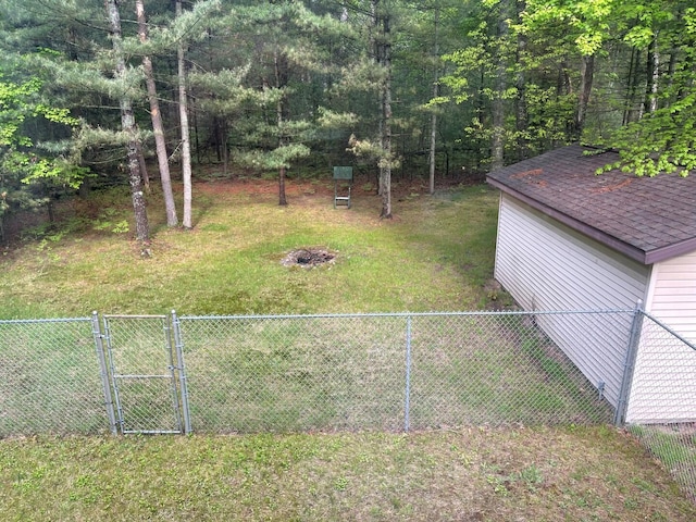 117 Swift Deer Trl, Prudenville, MI 48651 - view of yard featuring a gate