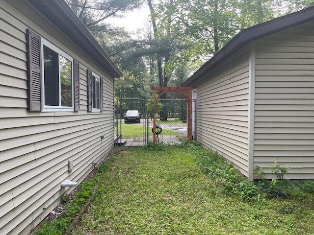 117 Swift Deer Trl, Prudenville, MI 48651 - view of yard with a gate
