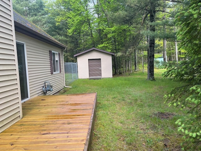 117 Swift Deer Trl, Prudenville, MI 48651 - view of green lawn featuring a deck