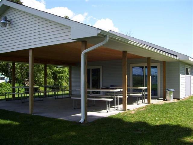 117 Swift Deer Trl, Prudenville, MI 48651 - view of community with a patio and a lawn