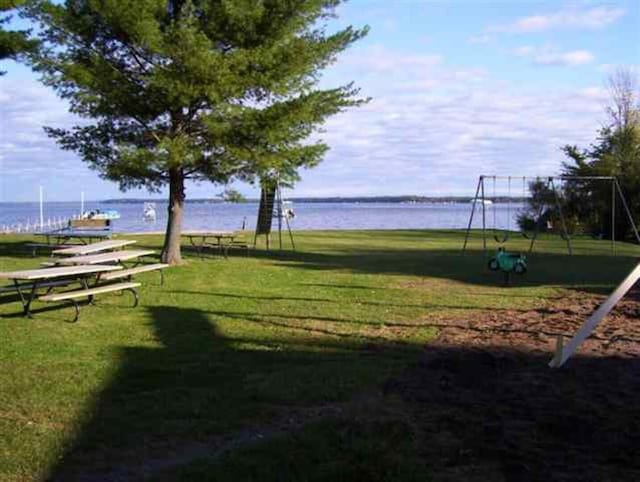 117 Swift Deer Trl, Prudenville, MI 48651 - surrounding community featuring a yard and a water view
