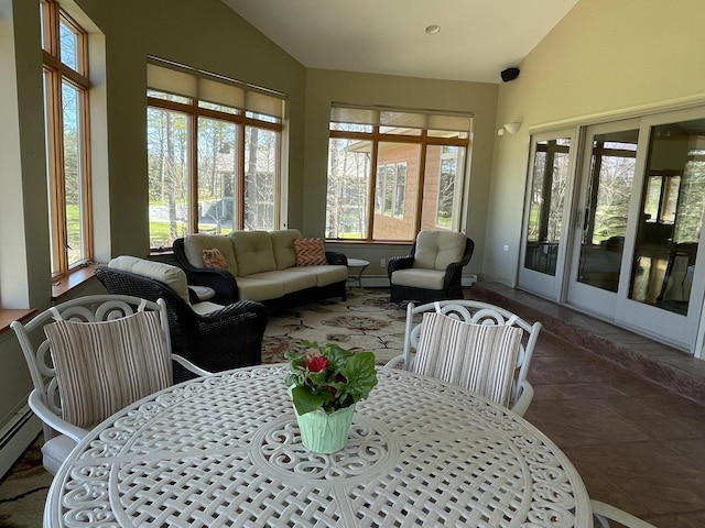 164 Invitational Dr, Gaylord, MI 49735 - sunroom with french doors, a baseboard heating unit, and high vaulted ceiling
