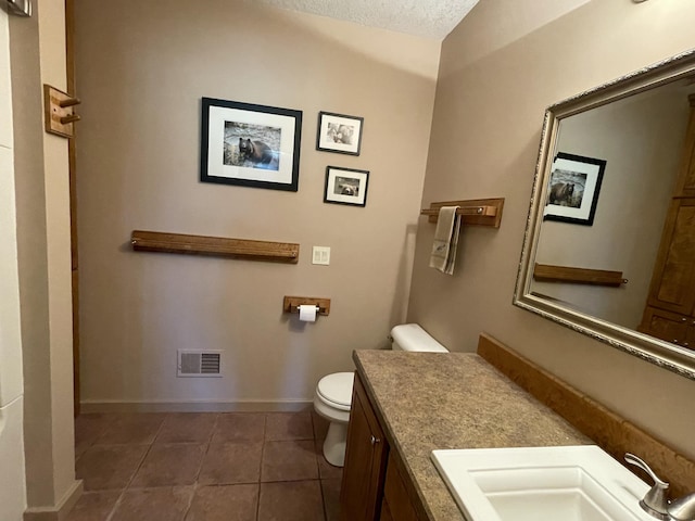 164 Invitational Dr, Gaylord, MI 49735 - bathroom with tile patterned flooring, vanity, and a textured ceiling