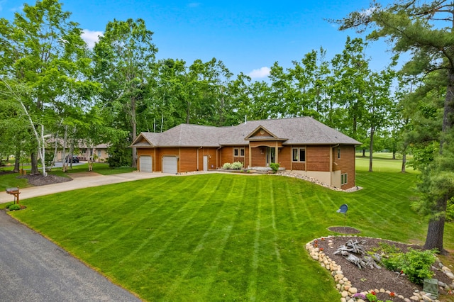 164 Invitational Dr, Gaylord, MI 49735 - view of front of house featuring an attached garage, a front lawn, and driveway