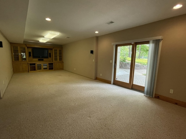 164 Invitational Dr, Gaylord, MI 49735 - unfurnished living room featuring light carpet and recessed lighting