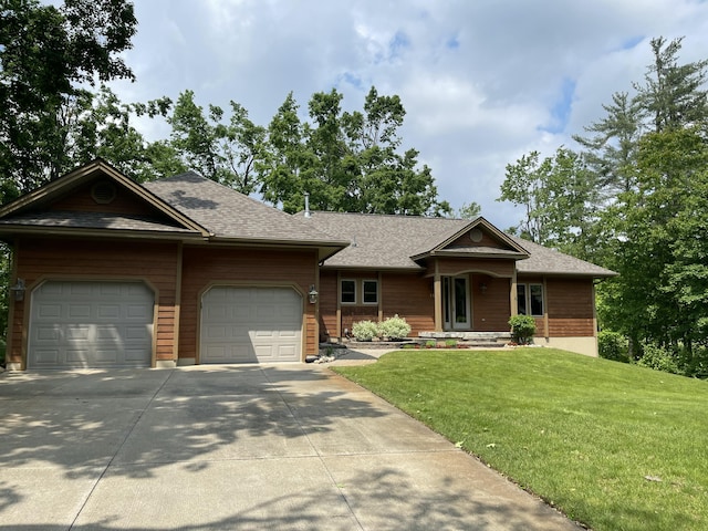 164 Invitational Dr, Gaylord, MI 49735 - view of front of house with a garage, concrete driveway, a front yard, and a shingled roof
