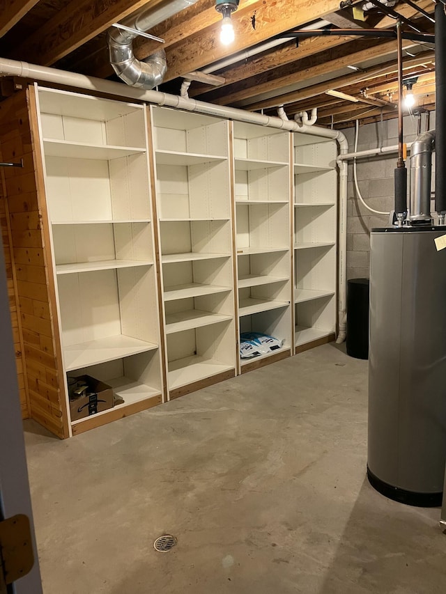 164 Invitational Dr, Gaylord, MI 49735 - unfinished below grade area featuring water heater