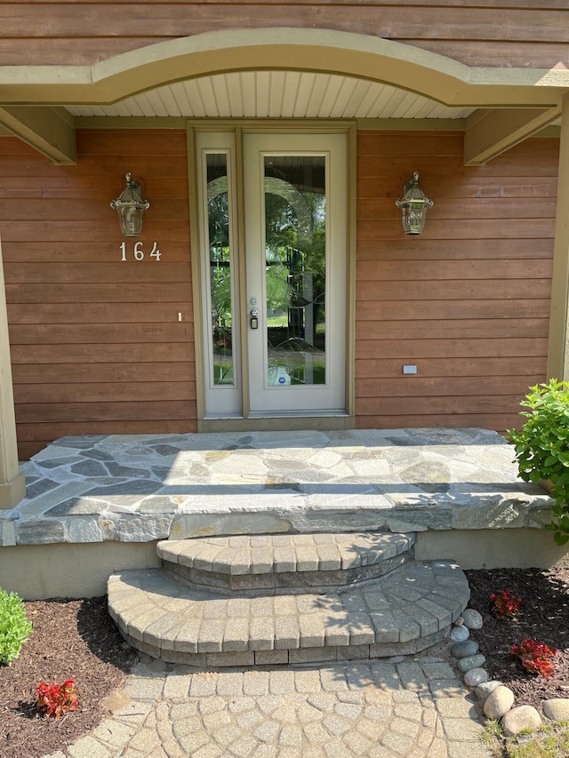 164 Invitational Dr, Gaylord, MI 49735 - doorway to property with a porch