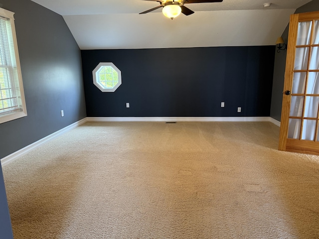 13551 US-23, Cheboygan, MI 49721 - additional living space featuring vaulted ceiling, a ceiling fan, and carpet floors
