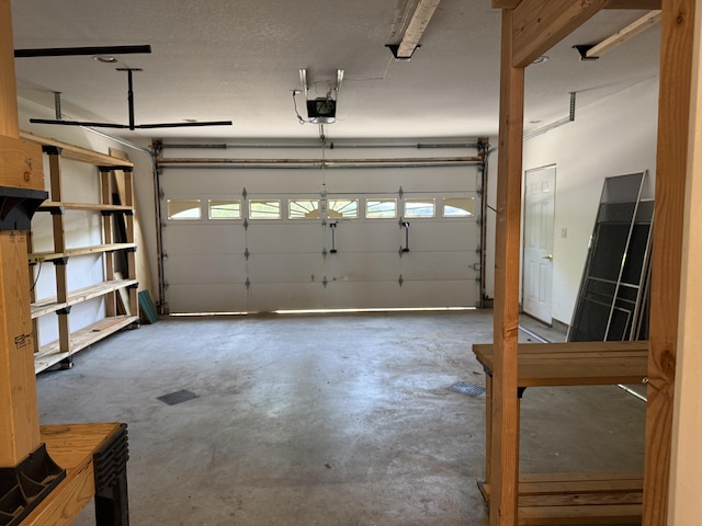 13551 US-23, Cheboygan, MI 49721 - garage featuring a garage door opener