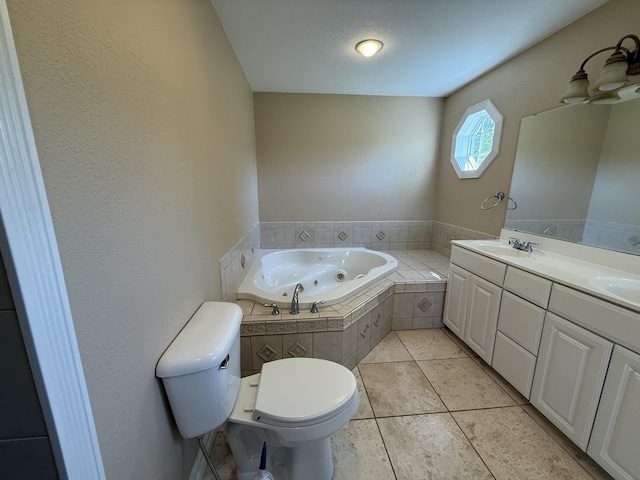 13551 US-23, Cheboygan, MI 49721 - bathroom with a tub with jets, double vanity, and tile patterned flooring