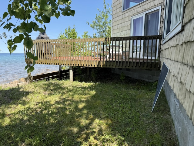 13551 US-23, Cheboygan, MI 49721 - view of grassy yard with a deck with water view