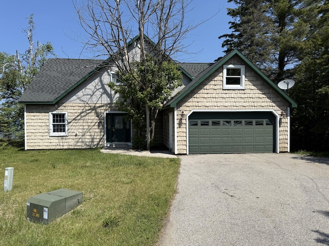 13551 US-23, Cheboygan, MI 49721 - view of front facade featuring driveway, a front lawn, and roof with shingles