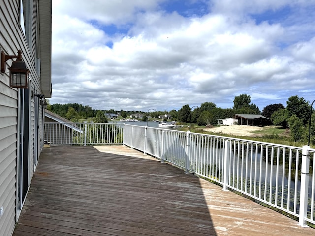 1537 Tecumseh Rd, Cheboygan, MI 49721 - wooden deck featuring a water view