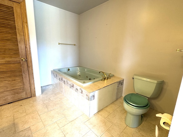 1537 Tecumseh Rd, Cheboygan, MI 49721 - full bathroom featuring toilet, a whirlpool tub, and stone tile floors