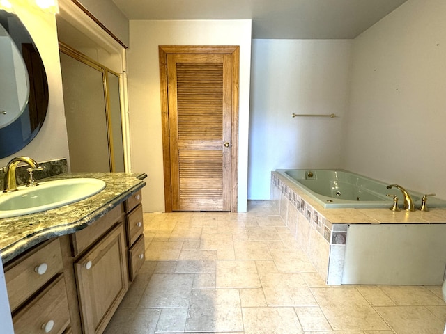 1537 Tecumseh Rd, Cheboygan, MI 49721 - full bath featuring vanity, a tub with jets, and stone tile floors