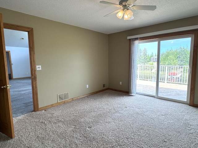 1537 Tecumseh Rd, Cheboygan, MI 49721 - empty room featuring carpet floors, a ceiling fan, a textured ceiling, and baseboards