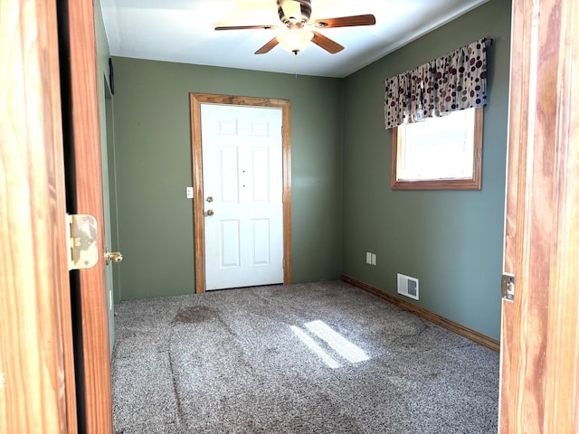 1537 Tecumseh Rd, Cheboygan, MI 49721 - empty room featuring a ceiling fan and carpet