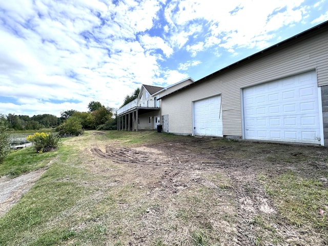 1537 Tecumseh Rd, Cheboygan, MI 49721 - view of side of home featuring a wooden deck