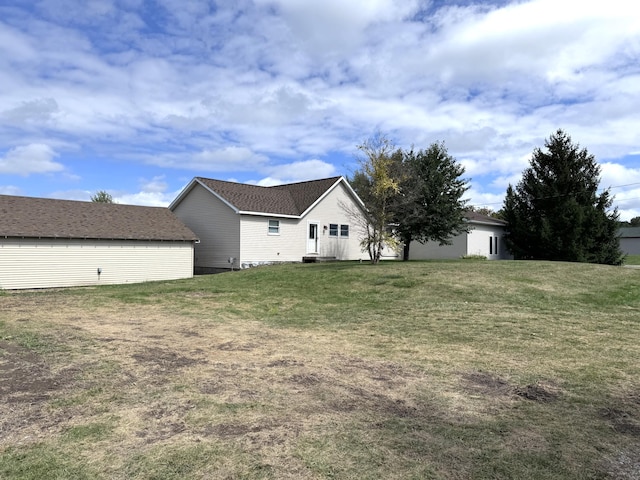 1537 Tecumseh Rd, Cheboygan, MI 49721 - back of house with a lawn