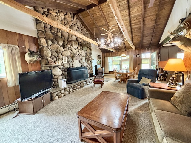 4650 Mckinley Rd, Mio, MI 48647 - carpeted living area featuring wooden ceiling, wood walls, a fireplace, and a chandelier