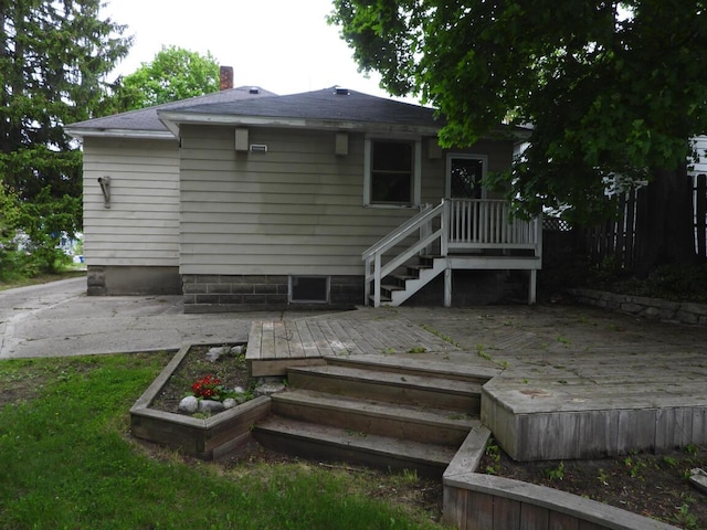 120 Copier St, Cadillac, MI 49601 - rear view of property with a chimney