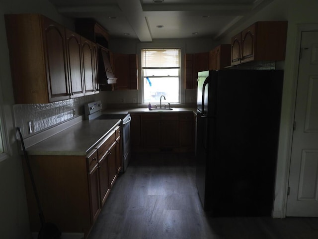 120 Copier St, Cadillac, MI 49601 - kitchen featuring freestanding refrigerator, range with electric cooktop, a sink, custom exhaust hood, and wood finished floors