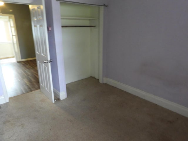 120 Copier St, Cadillac, MI 49601 - unfurnished bedroom featuring carpet flooring, a closet, and baseboards