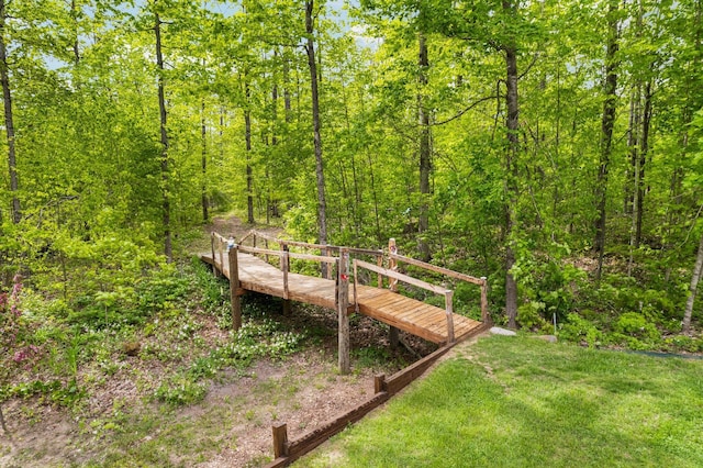2510 Primrose Rd, Elmira, MI 49730 - view of community featuring a forest view and a yard