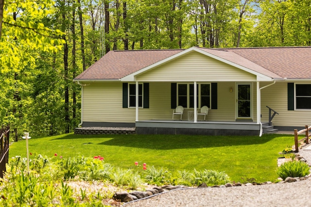2510 Primrose Rd, Elmira, MI 49730 - view of front of property featuring a porch, a front yard, and a shingled roof