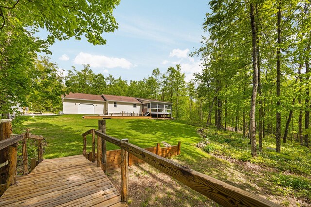 2510 Primrose Rd, Elmira, MI 49730 - wooden deck with a yard and a sunroom