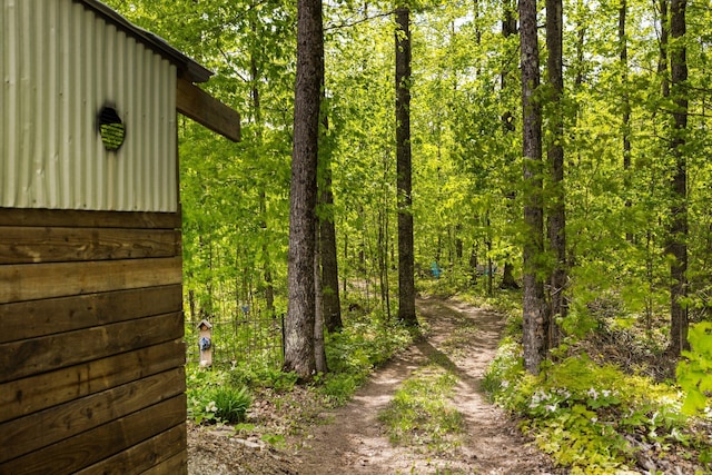 2510 Primrose Rd, Elmira, MI 49730 - view of yard featuring a forest view