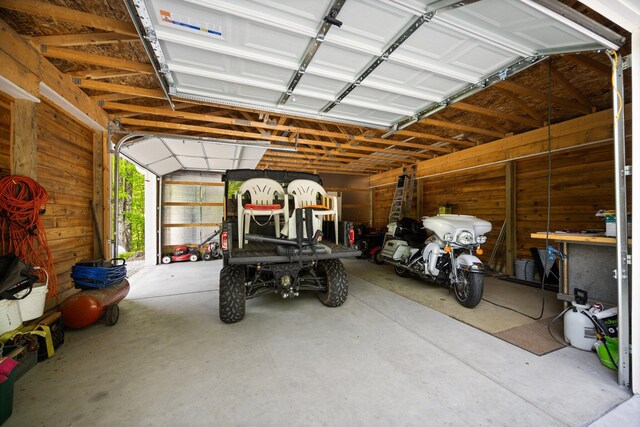 2510 Primrose Rd, Elmira, MI 49730 - garage featuring wooden walls