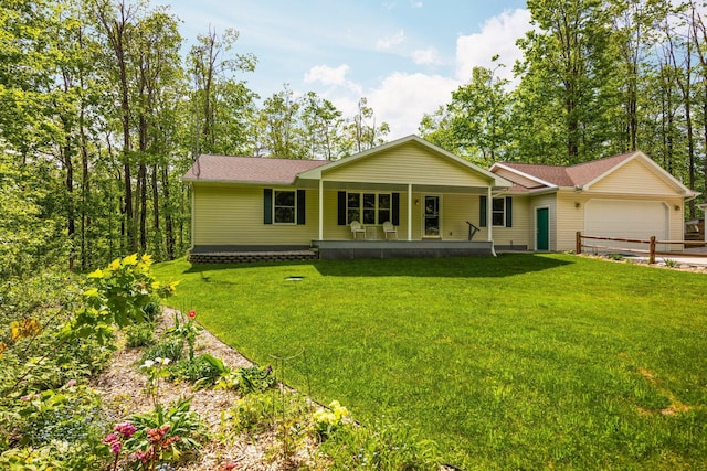 2510 Primrose Rd, Elmira, MI 49730 - ranch-style house featuring a porch, a garage, and a front lawn