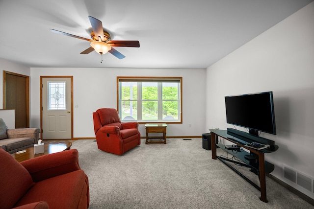 2510 Primrose Rd, Elmira, MI 49730 - living area featuring plenty of natural light, ceiling fan, baseboards, and carpet