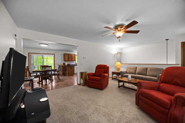 2510 Primrose Rd, Elmira, MI 49730 - living room featuring ceiling fan and light colored carpet