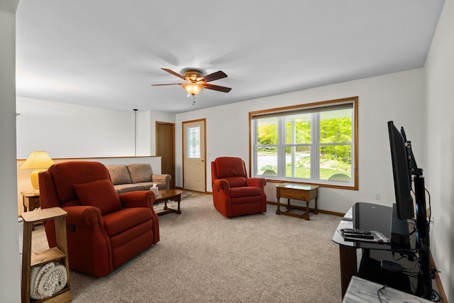 2510 Primrose Rd, Elmira, MI 49730 - living area featuring plenty of natural light, carpet, ceiling fan, and baseboards