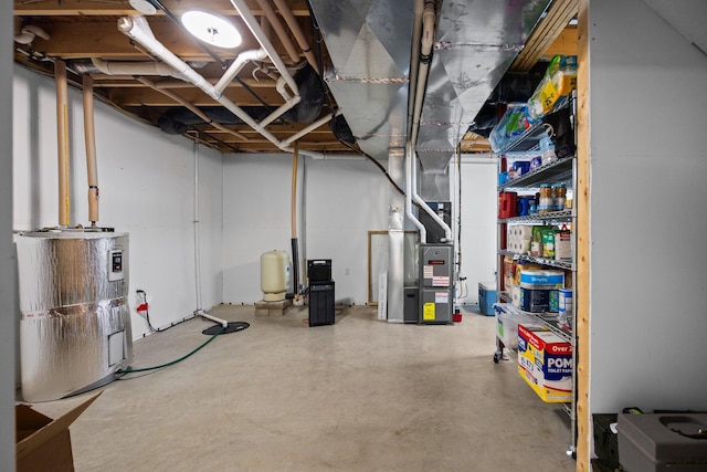 2510 Primrose Rd, Elmira, MI 49730 - unfinished below grade area featuring water heater, heating unit, and a water pressure tank