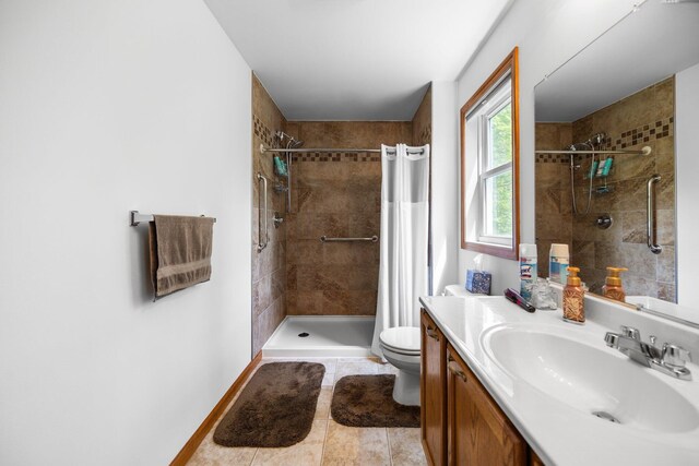 2510 Primrose Rd, Elmira, MI 49730 - bathroom with toilet, vanity, tiled shower, and tile patterned floors