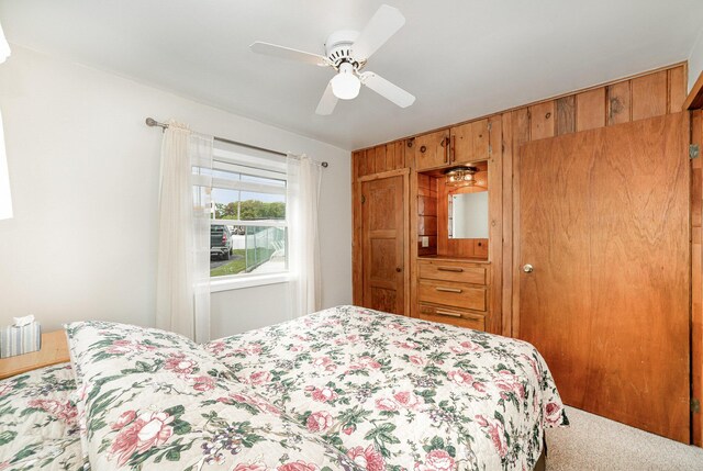 5616 W Houghton Lk, Houghton Lake, MI 48629 - bedroom featuring a ceiling fan and carpet floors