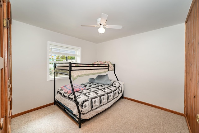5616 W Houghton Lk, Houghton Lake, MI 48629 - bedroom featuring light colored carpet, baseboards, and a ceiling fan