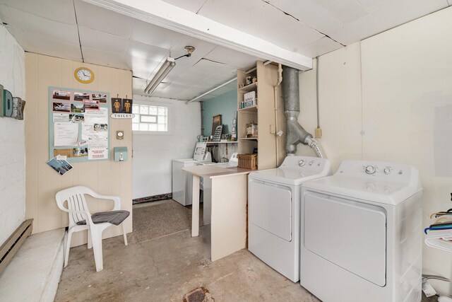 5616 W Houghton Lk, Houghton Lake, MI 48629 - washroom with baseboard heating and washing machine and clothes dryer