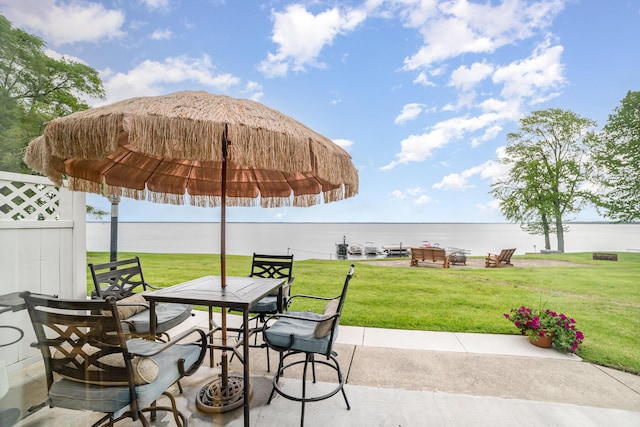 5616 W Houghton Lk, Houghton Lake, MI 48629 - view of patio featuring a water view and outdoor dining area